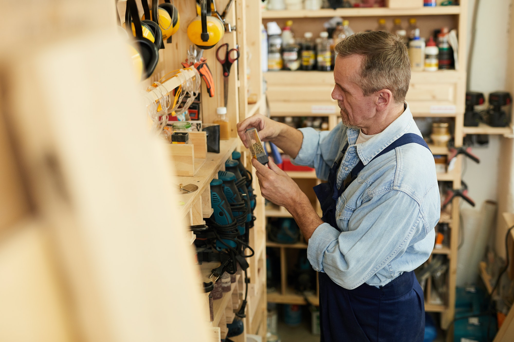 Senior Worker Choosing Tools